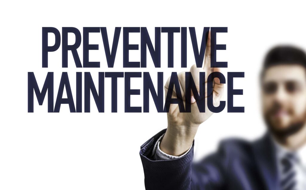 Man touching "Preventive Maintenance" text overlay.