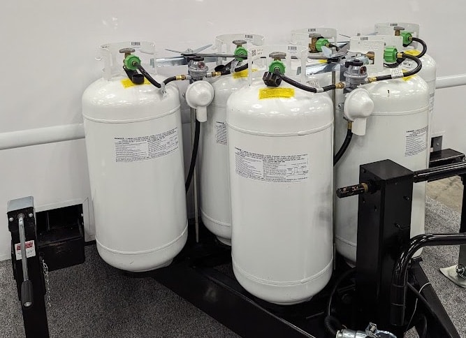 Industrial gas cylinders on pallet.