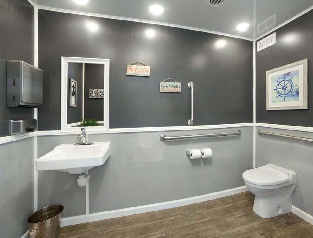 Modern bathroom with nautical decor and accessible features.
