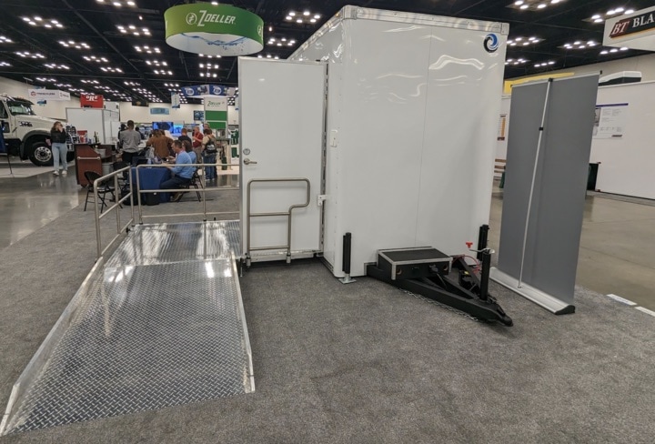 Mobile restroom trailer at trade show exhibit.