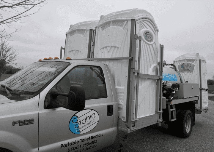Portable toilet rental service truck.