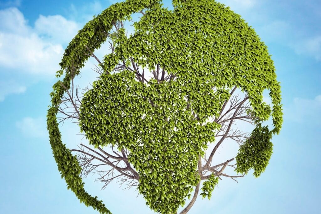 Green tree shaped like a globe, sustainability concept.