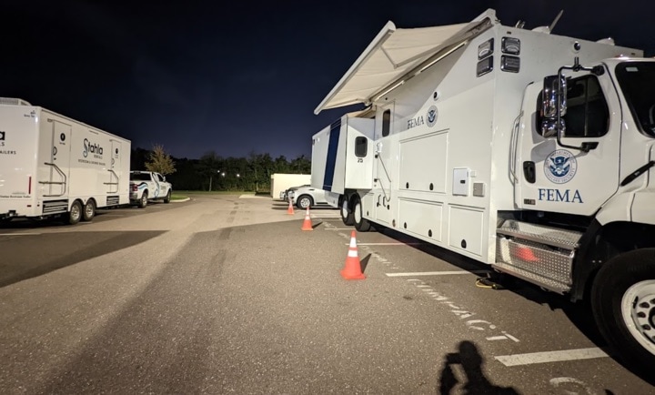 FEMA mobile command centers parked at night.