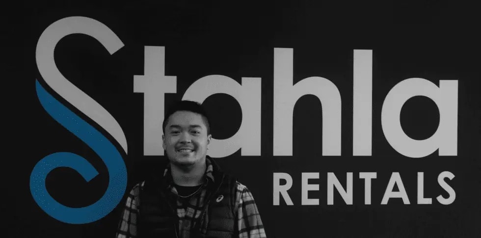 Man smiling in front of Stahla Rentals sign.