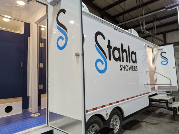 Stahla mobile shower trailer at indoor facility.