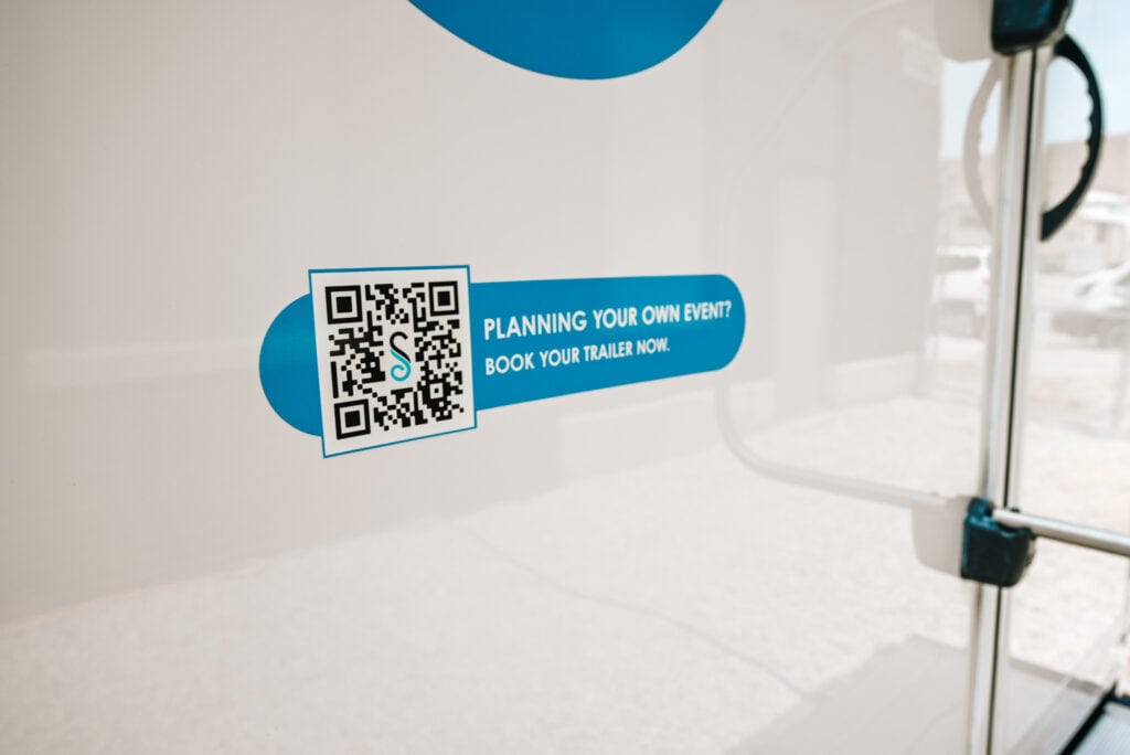 QR code for event trailer booking advertisement.