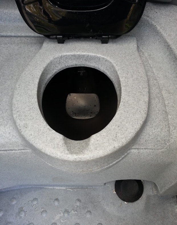 Close-up of a vehicle's oil change process.