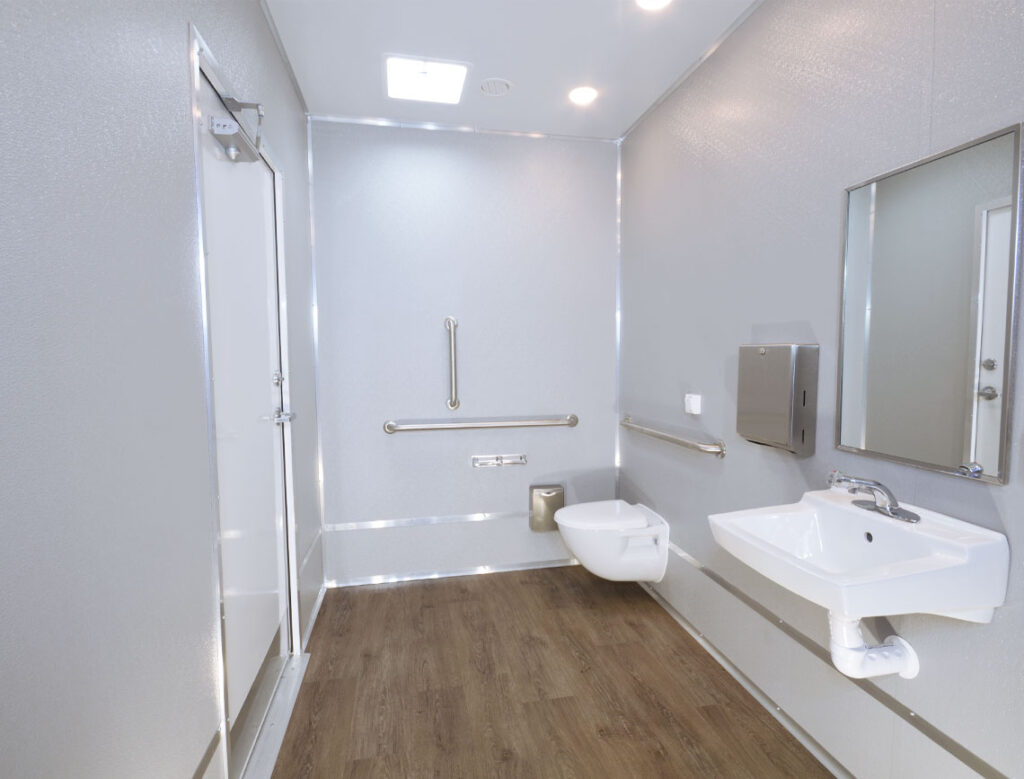 Accessible bathroom interior with grab bars.