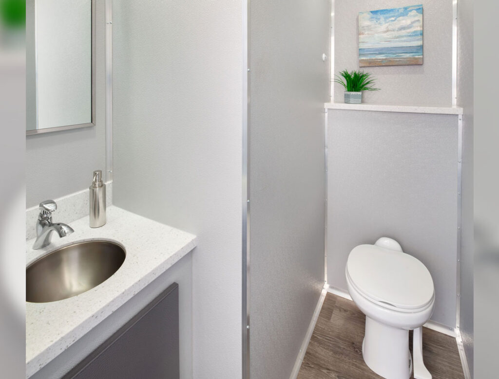 Image 4: Modern bathroom with sink and artwork