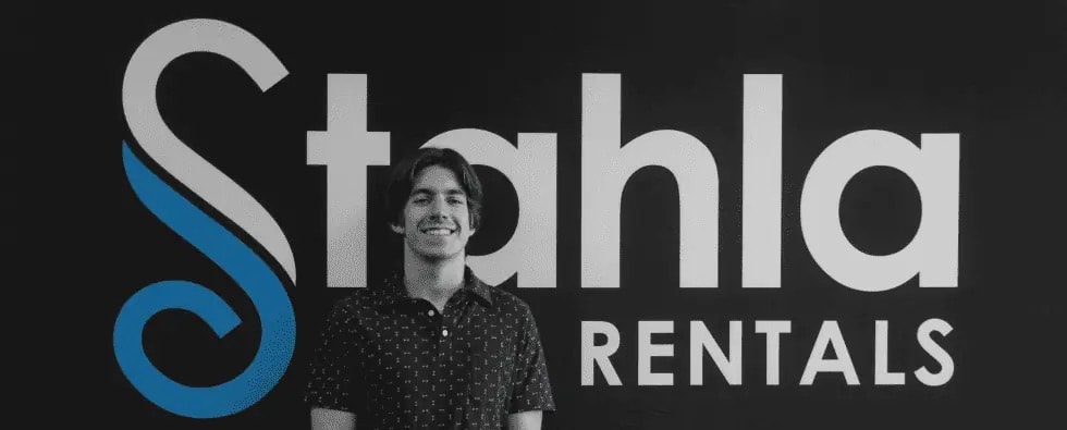 Smiling man beside Stahla Rentals logo.