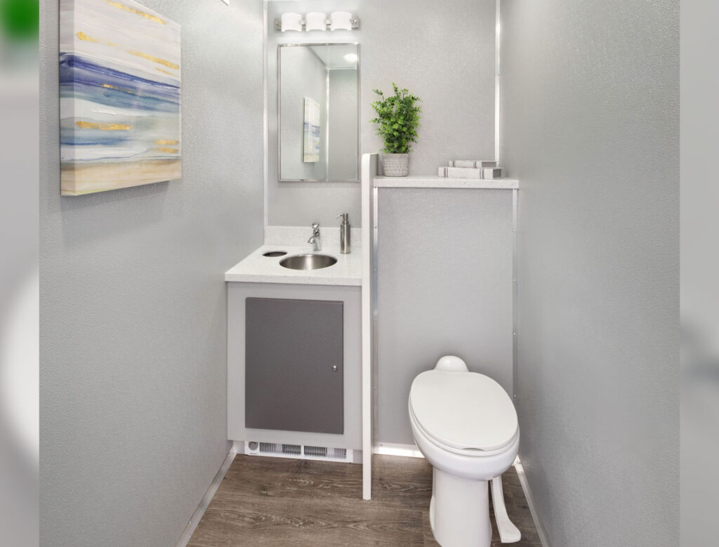 Modern small bathroom interior with artwork.
