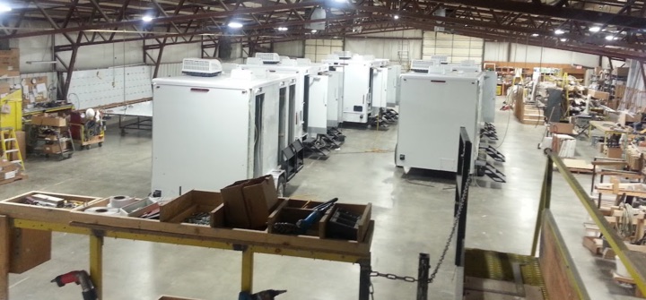 Industrial trailer manufacturing warehouse interior.