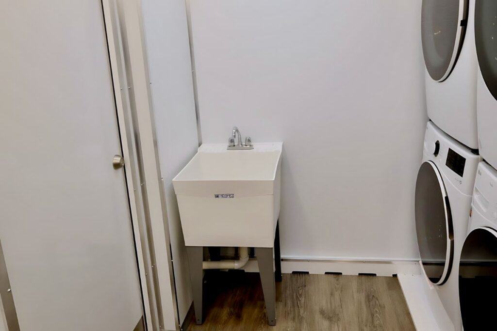 Laundry trailer with sink station